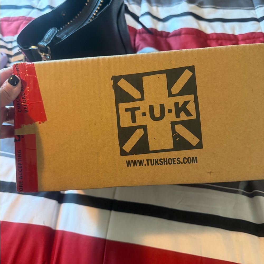 T.U.K. Black and White Packaging